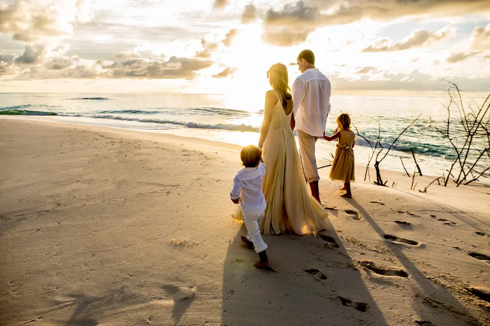 Denis Private Island_Wedding Family Walk Dusk